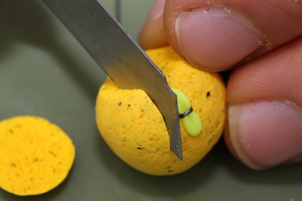 Use a sharp knife or scissors to trim away the hookbait skin...