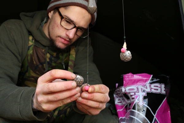 A small mouthful of pellet nicked onto the hook to increase attraction