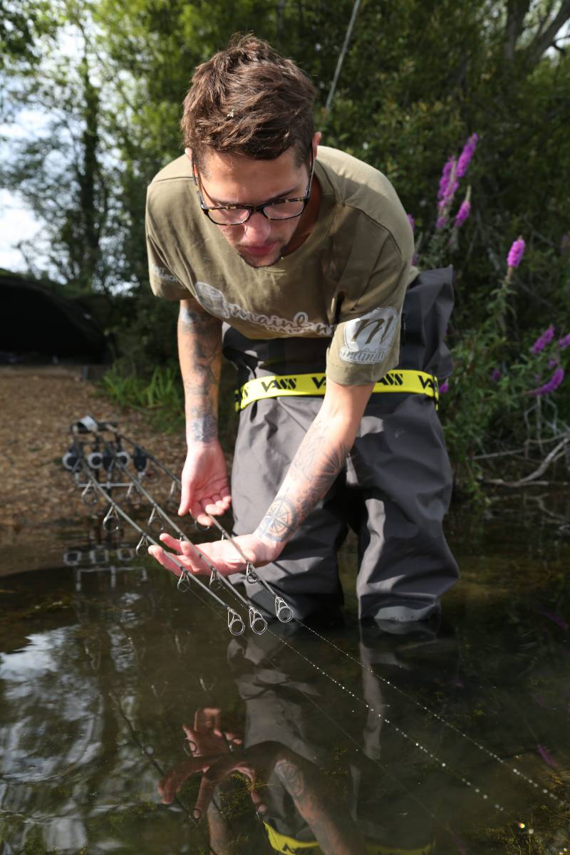 When your rods are fished together tightly on a single spot, holding your rod tips together like this on a tight line will tell you if any are crossed over