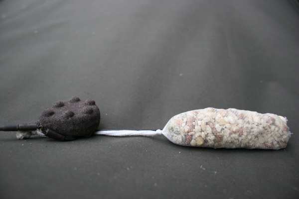 The rig plus PVA stocking will blend in with the little piles of bait.